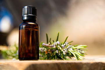 Rosemary oil in small glass bottle