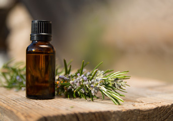 Rosemary oil in small glass bottle