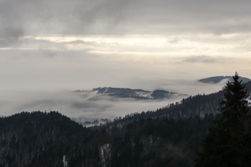 Naklejka na ściany i meble View from mountains with cloudy inversion below. Slovakia