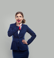 Astonished happy woman with shout mouth and eyes up. Studio shot with fly attendant.