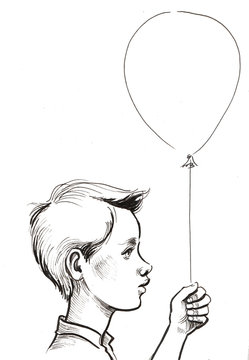 Boy holding a balloon