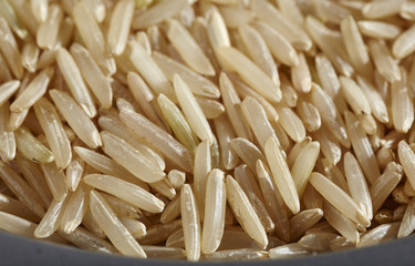 uncooked grains of brown basmati rice