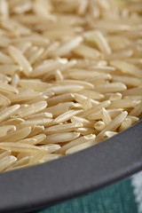 uncooked grains of brown basmati rice