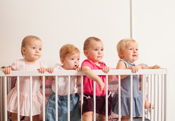 Three baby girls in the crib