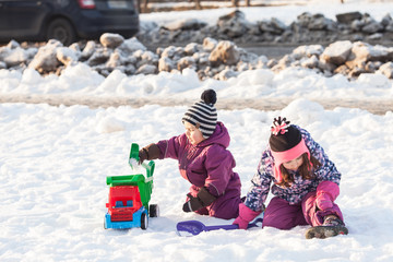 Children play on the snow
