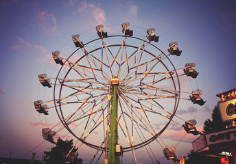  a fair ride during dusk on a warm summer evening toned with a r