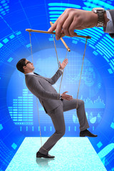 Businessman puppet being manipulated by boss