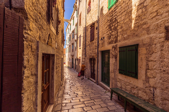 July 20, 2016:  An old lady in the cobblestone streets of the ol