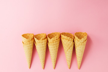 Empty Colorful Ice Cream Cones on Pink Background. Minimalism. F