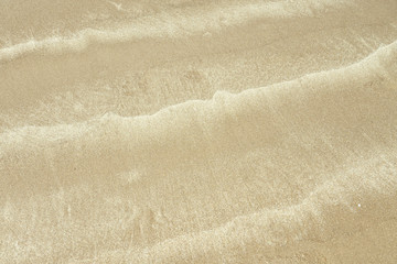 Fototapeta na wymiar Textured wet sand backgroud