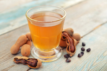 Tamarind juice with tamarind pods