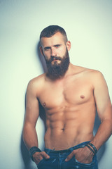 Fototapeta premium Portrait of handsome man standing, isolated on grey background