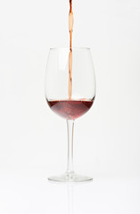 Pouring red wine in to glass