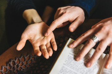 Naklejka premium Palmistry concept. Human hand, the value of the lines on the palm.