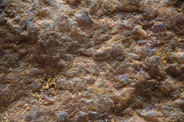Close up texture of a dry red rock as a background