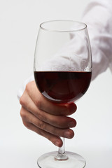 Hand holding wine glass