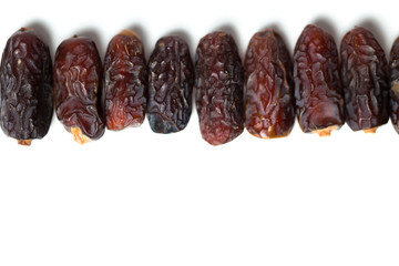 A dried dates isolated over white background