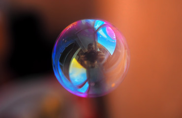 Soap bubble transparent and colorful all world in reflection