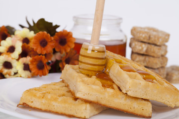 Fototapeta na wymiar Cookie with honey on a light background