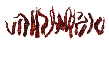 A dried chillies lay flat isolated over white background