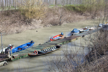 Boats moored in the port of the River Po. Brescello