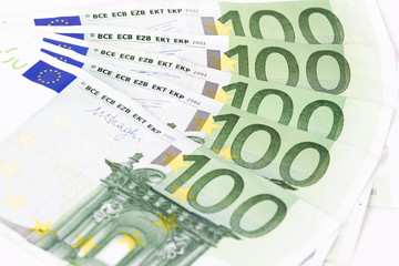 Close-up of One hundred euro banknotes on white background