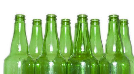 Row of open empty green bottles isolated on white background
