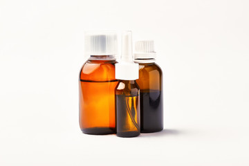 Nasal spray and cough syrup. Brown bottles with medicine. Your health is a treasure.