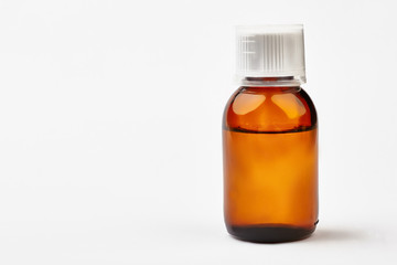 Bottle with liquid medicine. Transparent brown vial with lid. Stop your cold today.