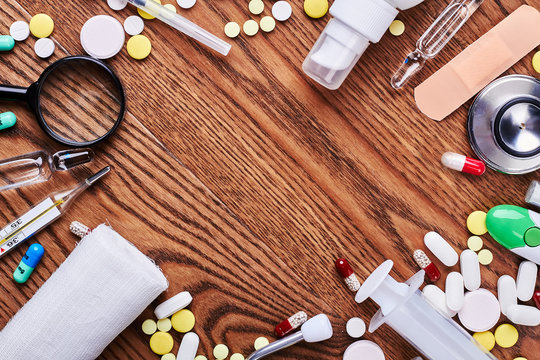 Medicines and tools on wood. Empty space for your advertisement.