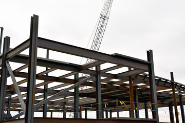 Multi story concrete and steel commercial building under construction.