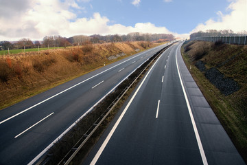 Highway runs through a rural landscape in northern Germany, german autobahn