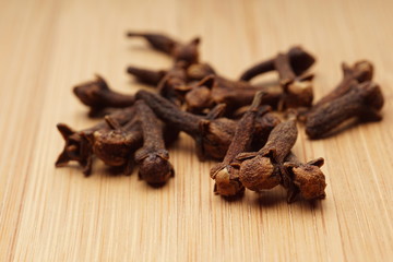 Cloves on wooden background