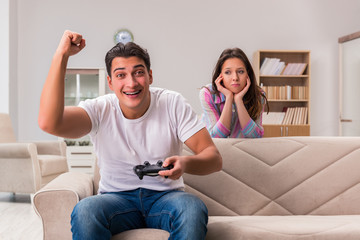 Young family suffering from computer games addiction