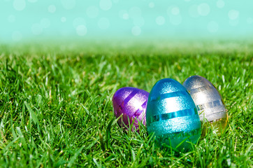 Easter eggs on the grass and sky background