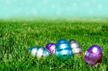 Easter eggs on the grass and sky background