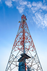 Mobile phone communication antenna tower with the blue sky and c