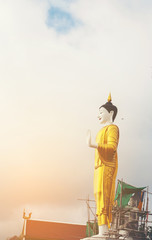  statue of buddha on blue sky background