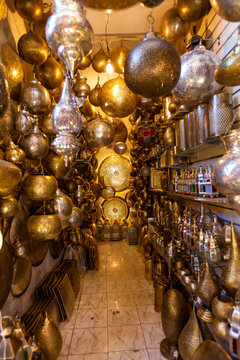 Narrow shop of traditional Moroccan lamps in the souk of Marrake