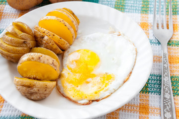 Baked potatoes and yellow fried for breakfast