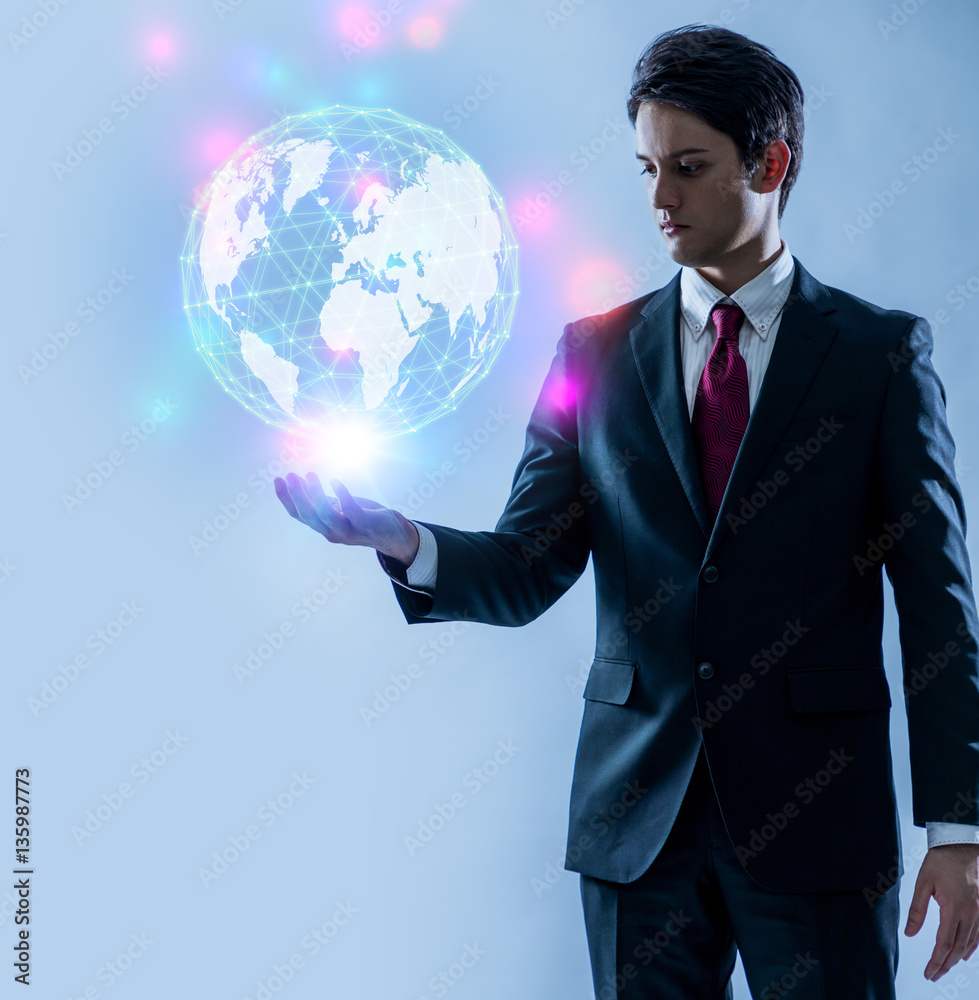 Poster young businessman looking at a abstract object floating on her hands, communication network concept.