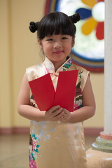 Happy Little asian girl in chinese traditional dress smiling and