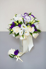 Close up of beautiful wedding bouquet and boutonniere
