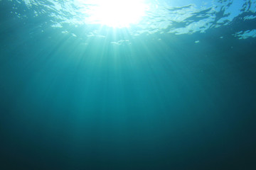 Fototapeta na wymiar Underwater ocean background with sunlight