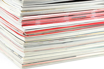 close up on stacking magazines isolated on white background