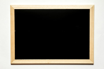 Blank black board with wood frame on white background