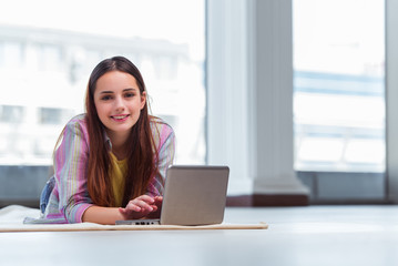 Young girl surfing internet on laptop