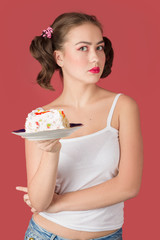 sad woman with sweet cake on red background