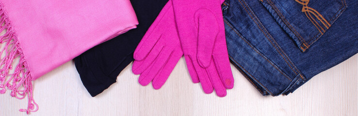 Womanly clothes on wooden background, clothing for autumn or winter