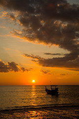 Fototapeta na wymiar Long tailed boat at sunset